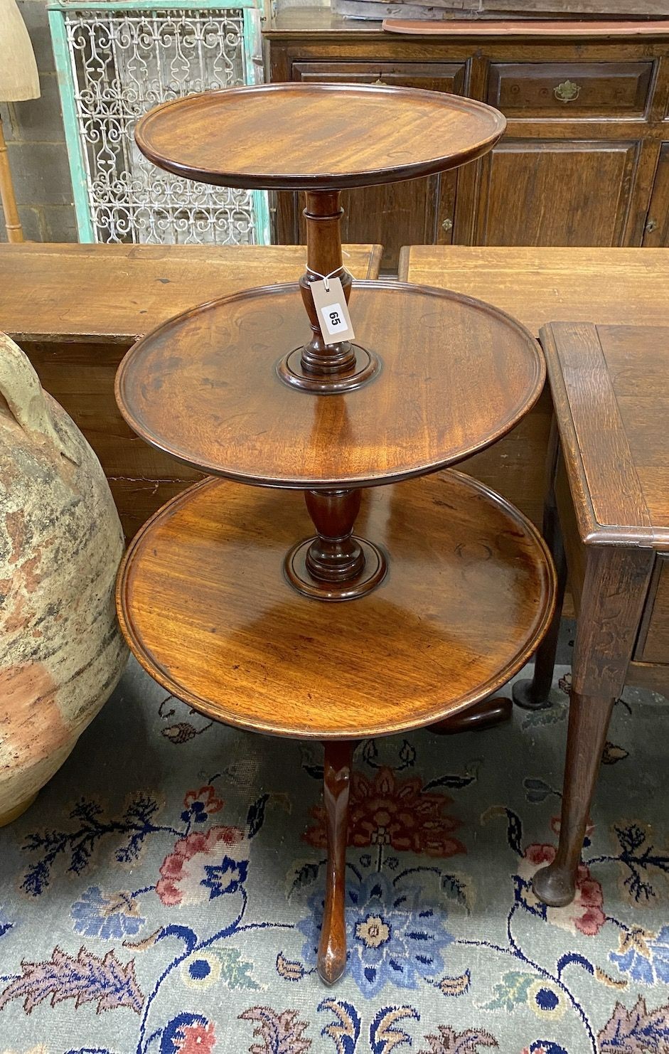 A George III mahogany three tier dumb waiter, height 108cm